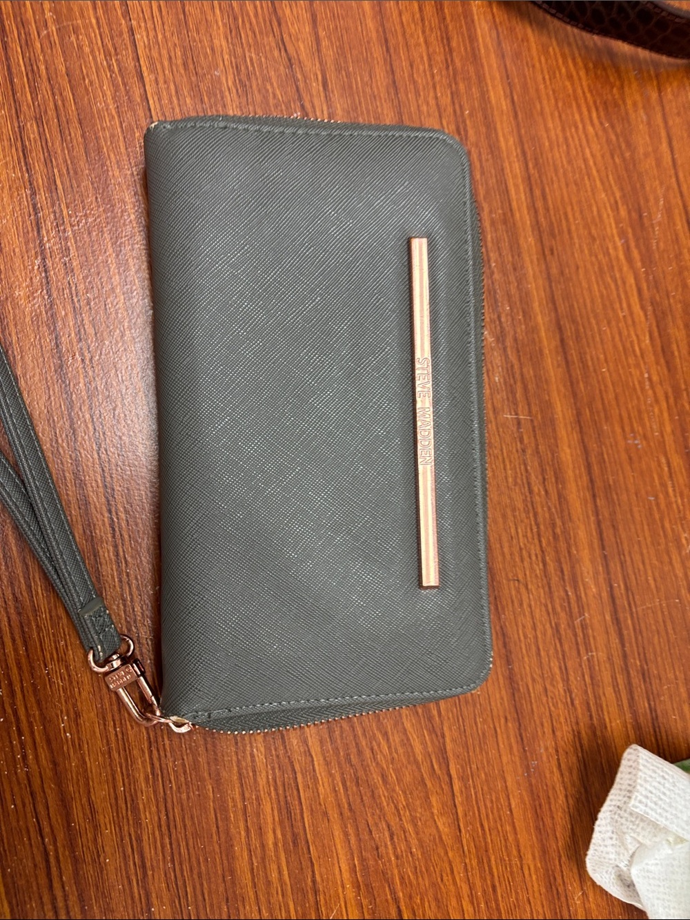 Michael Kors Olive Green Zip-Around Wristlet with Rose Gold Accent- minor peel